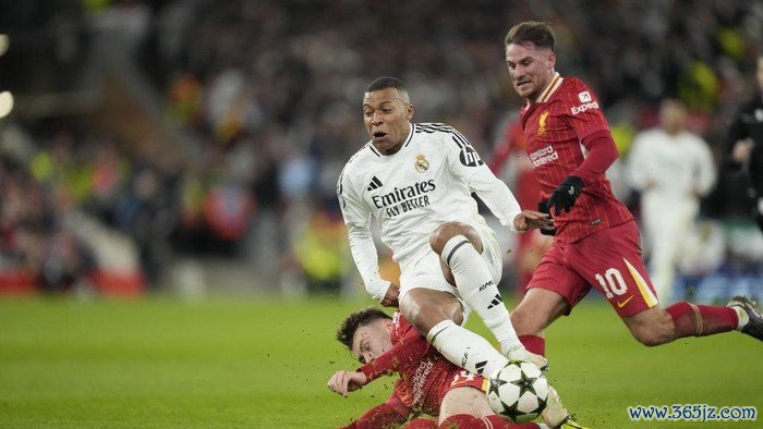 LIVERPOOL, ENGLAND - NOVEMBER 27: Kylian Mbappe centre-forward of Real Madrid and France and Conor Bradley right-back of Liverpool and Northern Ireland compete for the ball during the UEFA Champions League 2024/25 League Phase MD5 match between Liverpool FC and Real Madrid C.F. at Anfield on November 27, 2024 in Liverpool, England. (Photo by Jose Hernandez/Anadolu via Getty Images)