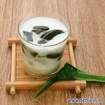 Es Cincau Hijau (green grass jelly), a traditional Indonesian dessert. Made from cincau, coconut milk and palm sugar. Selected focus.